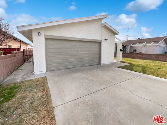 garage with a lawn