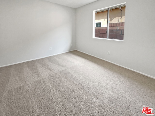 empty room featuring carpet flooring