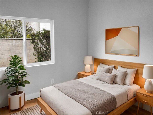 bedroom featuring hardwood / wood-style floors