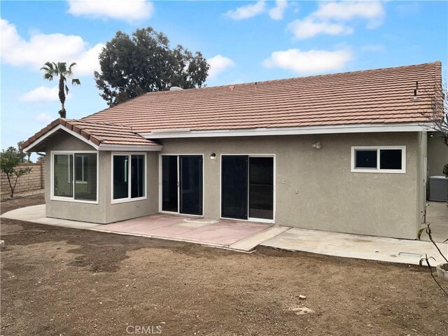 back of house with a patio