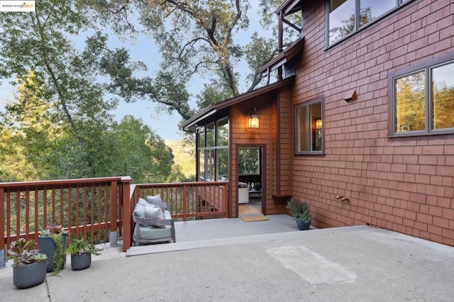 deck with a sunroom