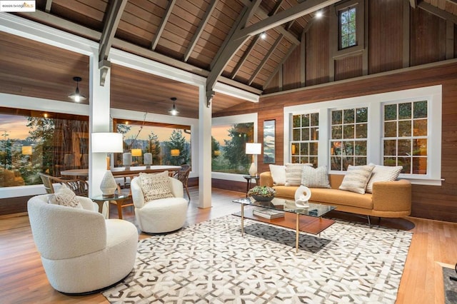 sunroom / solarium featuring wood ceiling and lofted ceiling with beams