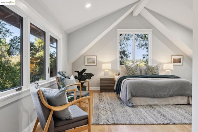 bedroom with wood-type flooring and lofted ceiling with beams