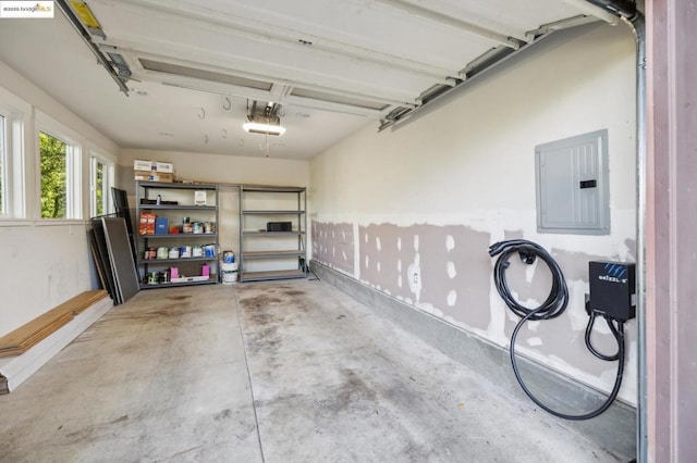 garage featuring a garage door opener and electric panel