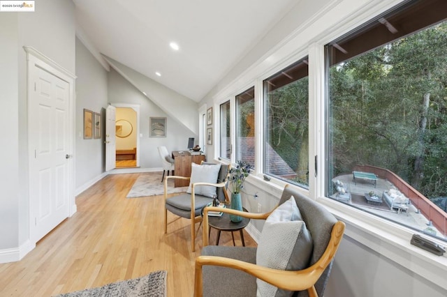 sunroom featuring vaulted ceiling