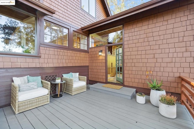 deck featuring outdoor lounge area