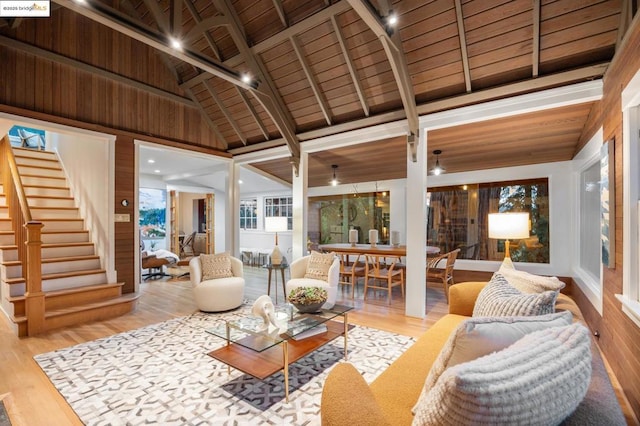 sunroom featuring vaulted ceiling with beams and wooden ceiling