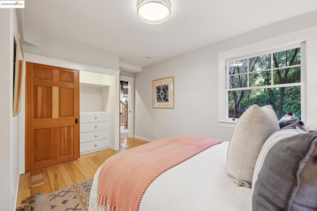 bedroom featuring light wood-type flooring