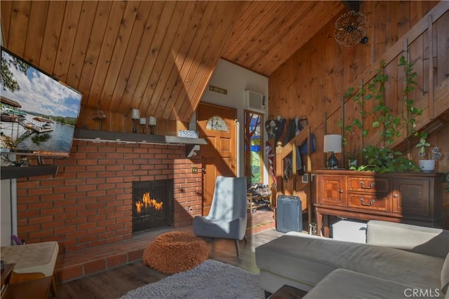 living room featuring a wall mounted air conditioner, wooden walls, a fireplace, hardwood / wood-style flooring, and wood ceiling