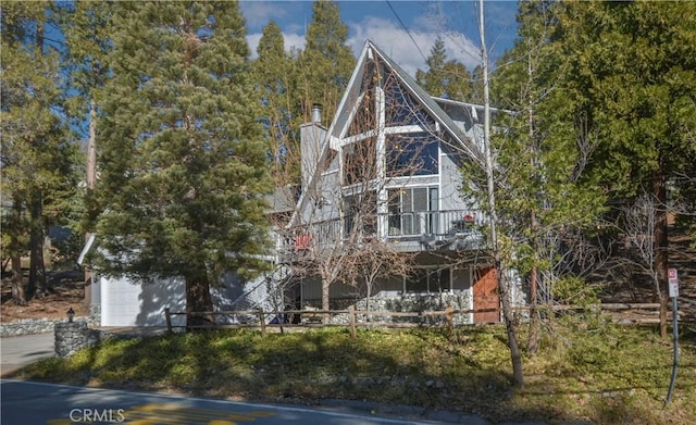 view of front of property with a balcony