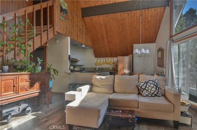 living room with wood-type flooring and high vaulted ceiling