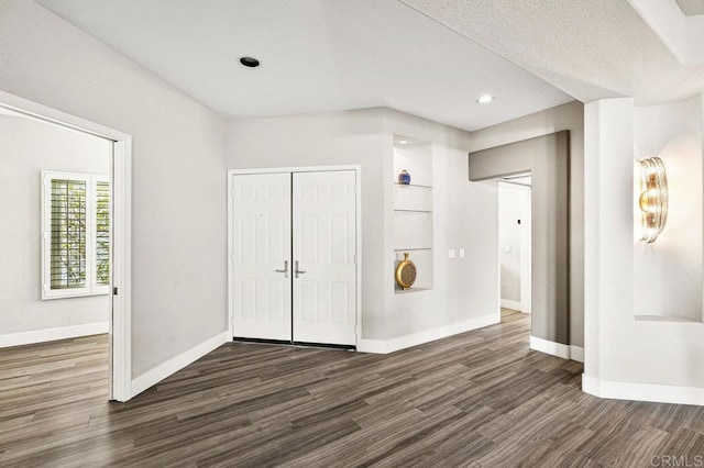 entrance foyer featuring dark hardwood / wood-style floors