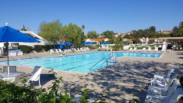 view of swimming pool featuring a patio area