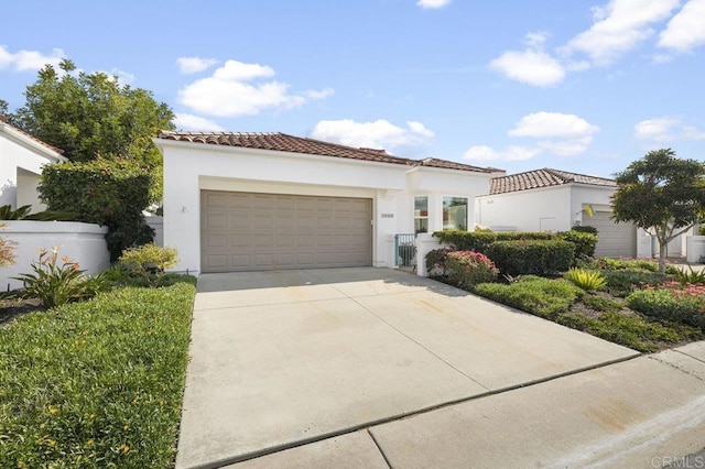 mediterranean / spanish-style home featuring a garage