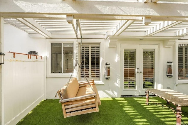 rear view of house featuring a yard and french doors