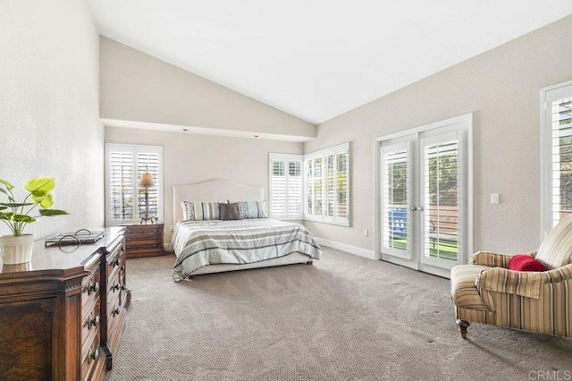 carpeted bedroom featuring multiple windows, access to exterior, and high vaulted ceiling