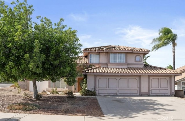 mediterranean / spanish-style home featuring a garage