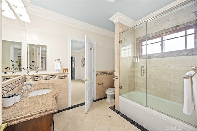 full bathroom with crown molding, combined bath / shower with glass door, tile walls, tile patterned flooring, and toilet