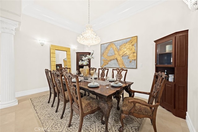 dining space with decorative columns, ornamental molding, and a chandelier