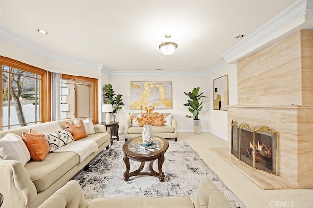 living room featuring ornamental molding and a high end fireplace