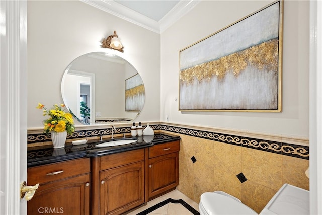 bathroom featuring crown molding, tile walls, vanity, and toilet