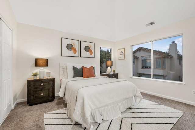 bedroom with light colored carpet