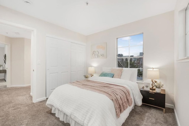 carpeted bedroom featuring a closet