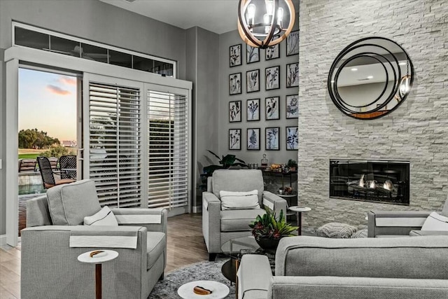 living room featuring an inviting chandelier and hardwood / wood-style flooring