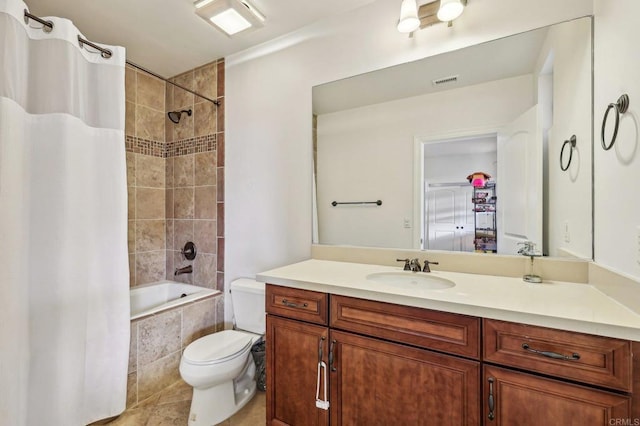 full bathroom with vanity, toilet, tile patterned floors, and shower / bath combo with shower curtain