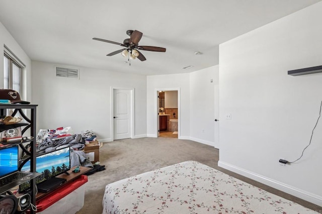 bedroom with ensuite bath, carpet floors, and ceiling fan