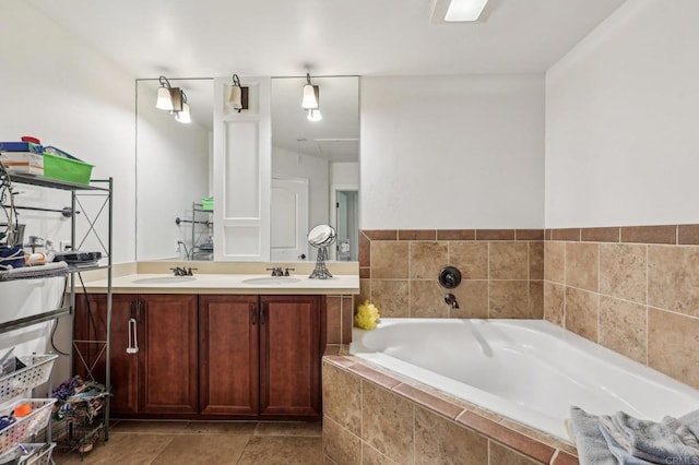 bathroom featuring vanity and tiled bath