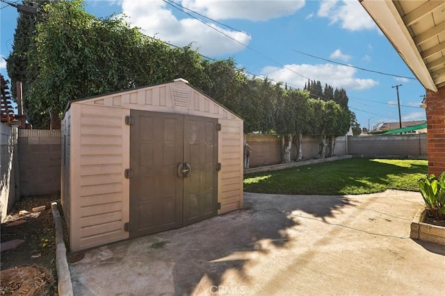 view of shed featuring a fenced backyard