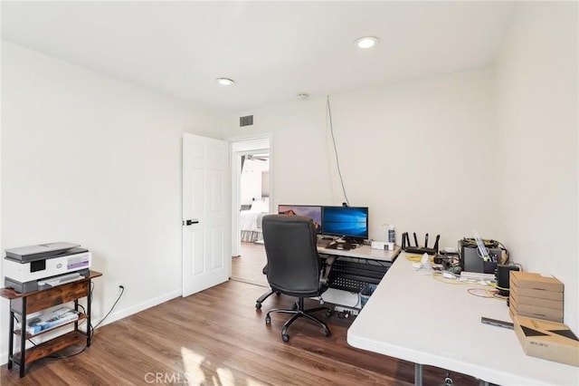 home office with baseboards, visible vents, wood finished floors, and recessed lighting