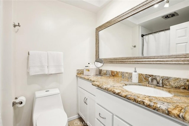 full bathroom featuring visible vents, vanity, and toilet