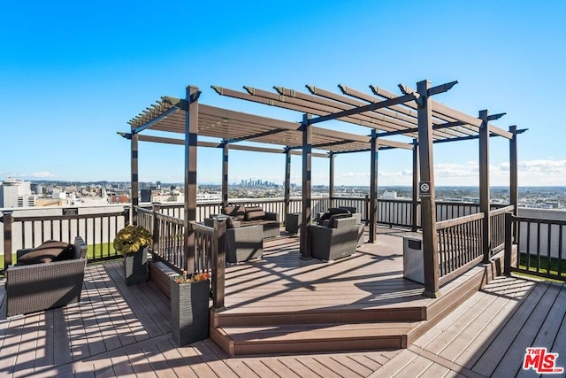 wooden deck featuring a pergola and outdoor lounge area