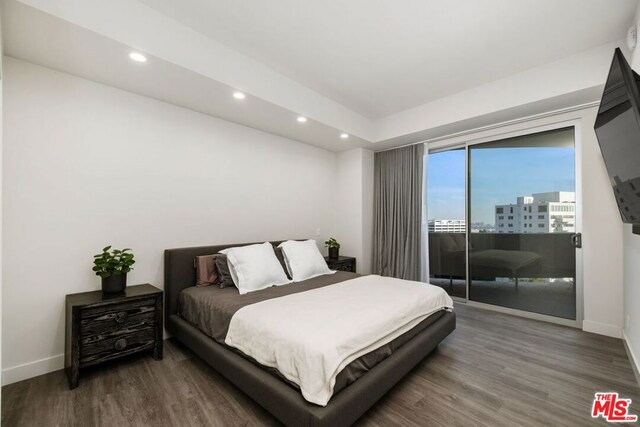 bedroom with access to exterior and wood-type flooring