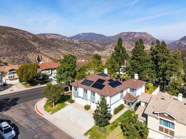 birds eye view of property with a mountain view