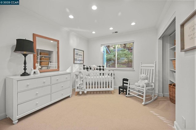 bedroom featuring light carpet and crown molding