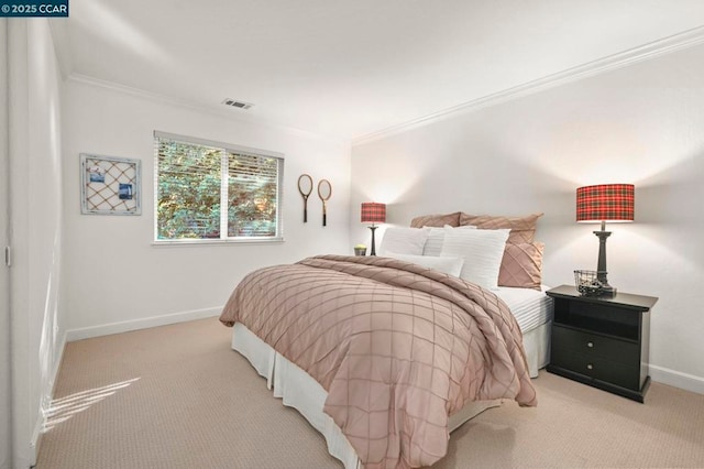 carpeted bedroom with ornamental molding