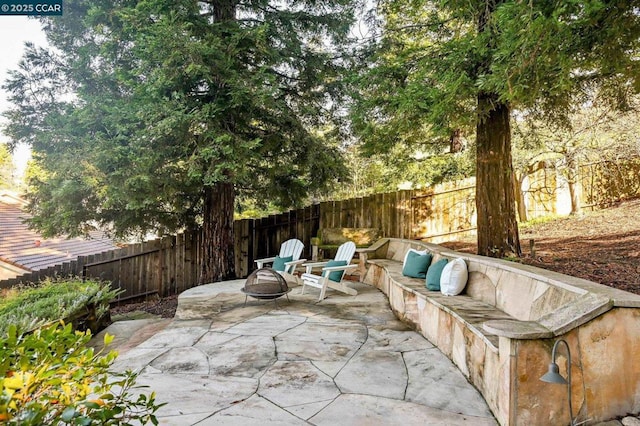 view of patio with an outdoor fire pit