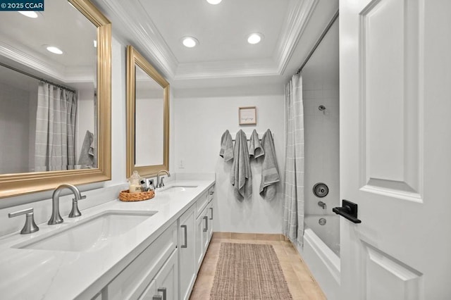 bathroom with shower / tub combo, vanity, crown molding, and a tray ceiling