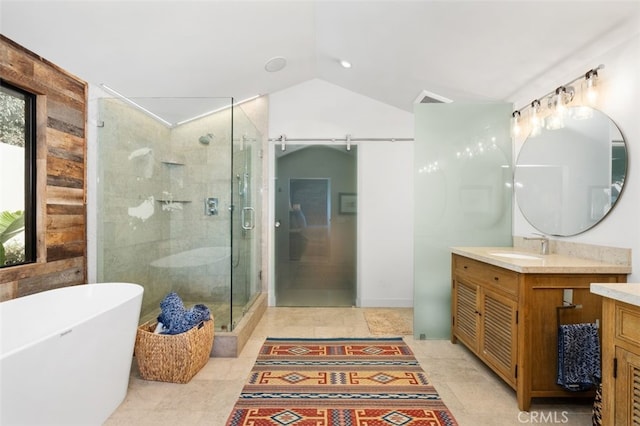 bathroom featuring lofted ceiling, shower with separate bathtub, and vanity