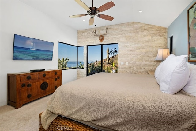 carpeted bedroom featuring ceiling fan and vaulted ceiling