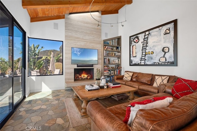 living room with built in features, high vaulted ceiling, a fireplace, wood ceiling, and beam ceiling