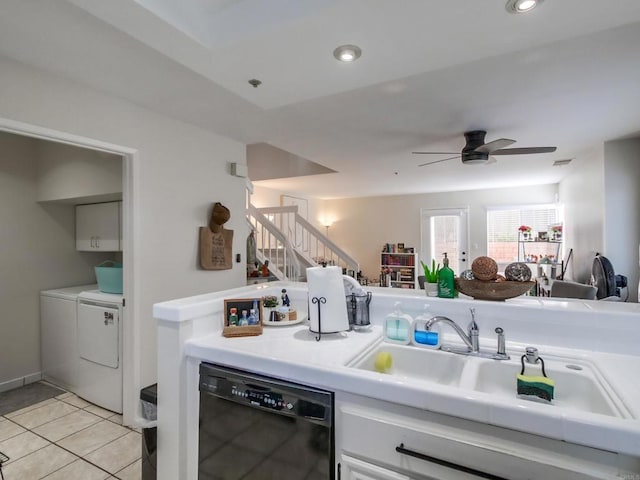 kitchen featuring black dishwasher, sink, light tile patterned floors, ceiling fan, and independent washer and dryer