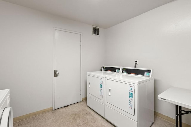 laundry room featuring separate washer and dryer