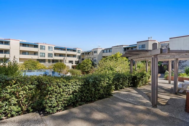 view of home's community featuring a pergola