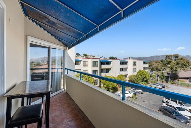 balcony featuring a mountain view