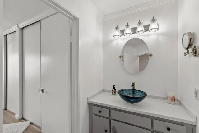 bathroom featuring vanity and crown molding