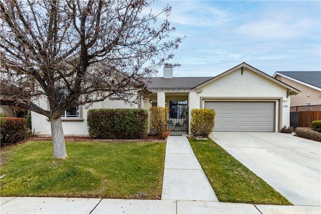 ranch-style house with a garage and a front lawn